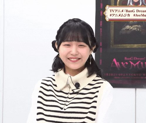 a girl is standing in front of a poster that says bang dream