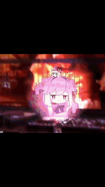 a cartoon character with a skull on her head is surrounded by flames .