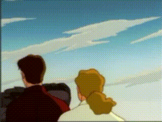 a man and a woman are looking at a cloud in the sky