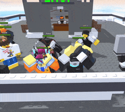 a group of people are playing a video game and one of them is wearing a shirt that says ' peanut butter ' on it