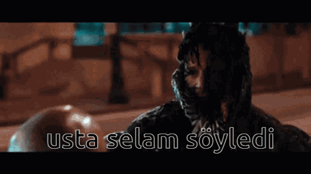 a close up of a person 's face with the words usta selam söyledi on the bottom