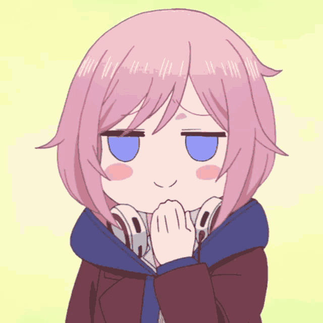 a girl with pink hair is wearing headphones