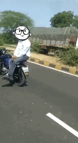 a man riding a motorcycle with a license plate that says 4458