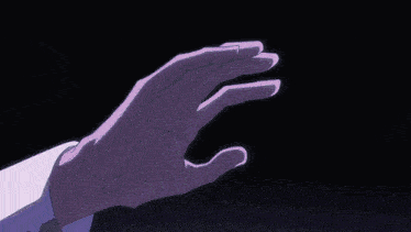 a close up of a person 's hand with a blue object in it .