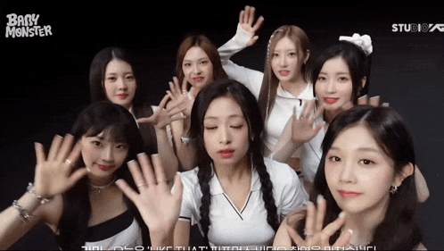 a group of young women are posing for a picture with the words baby monster on the bottom right