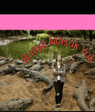 a woman stands in front of a pond surrounded by crocodiles with buaya masuk yuk written in red