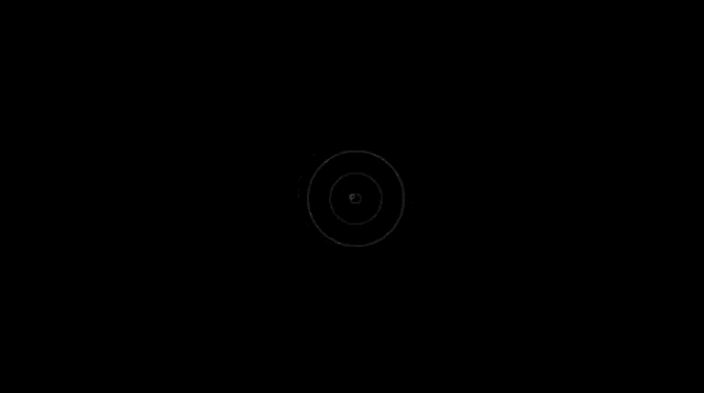 a red circle is spinning on a black background