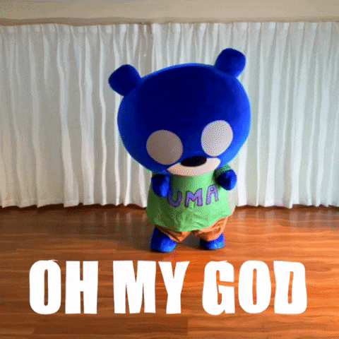 a blue teddy bear wearing a green shirt with the word uma on it