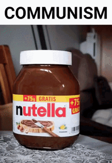 a jar of nutella sits on a table with the word communism above it