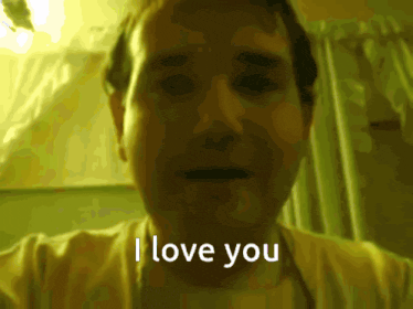 a man is saying i love you in a dark room