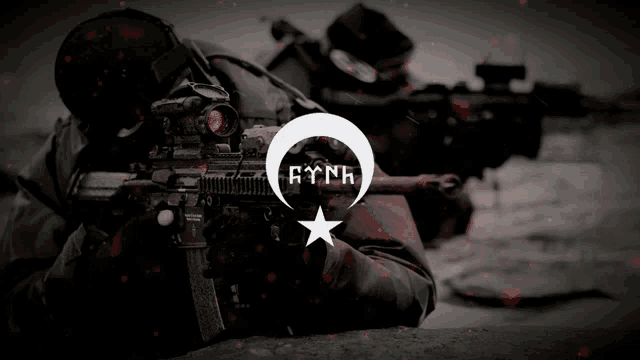 a black and white photo of a man holding a rifle with a crescent moon and a star with the word aynk on it