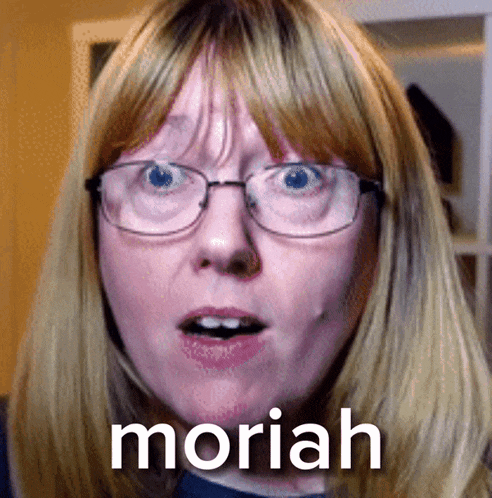 a woman wearing glasses is making a funny face and the word moriah is on the bottom