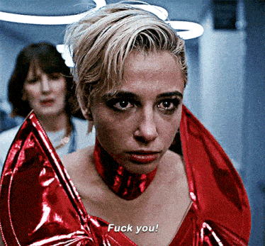a woman wearing a red dress says fuck you