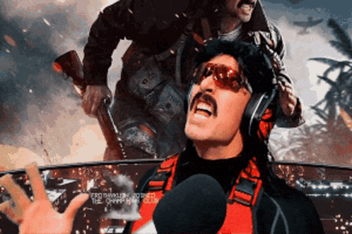 a man with a mustache wearing sunglasses and headphones is talking into a microphone while another man holds a gun