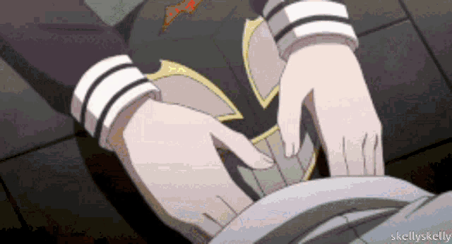 a gif of a person being touched by another person with skellyskelly written in the lower right corner