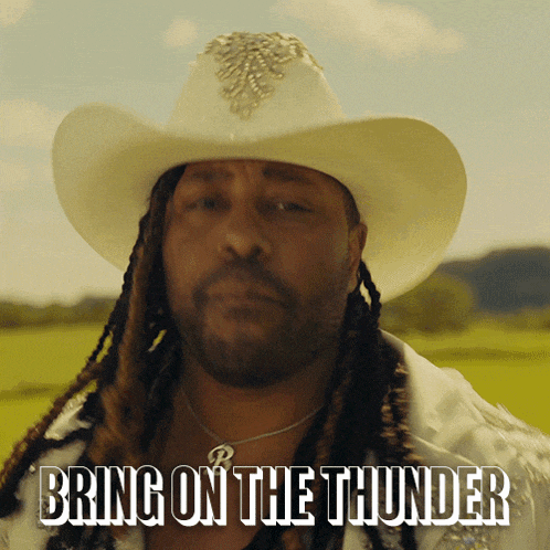 a man with dreadlocks wearing a cowboy hat says " bring on the thunder "