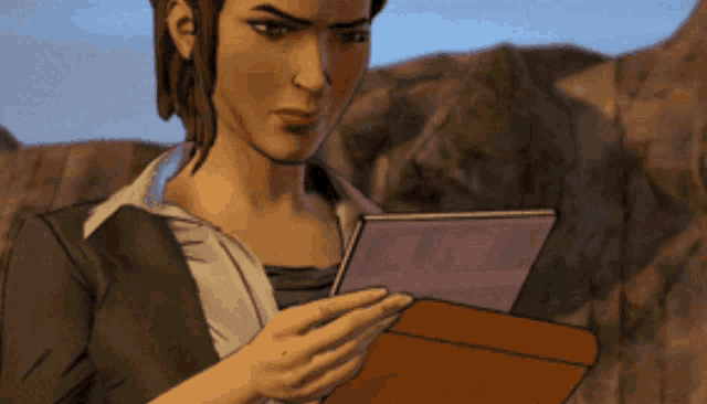 a woman is holding a piece of paper in her hands