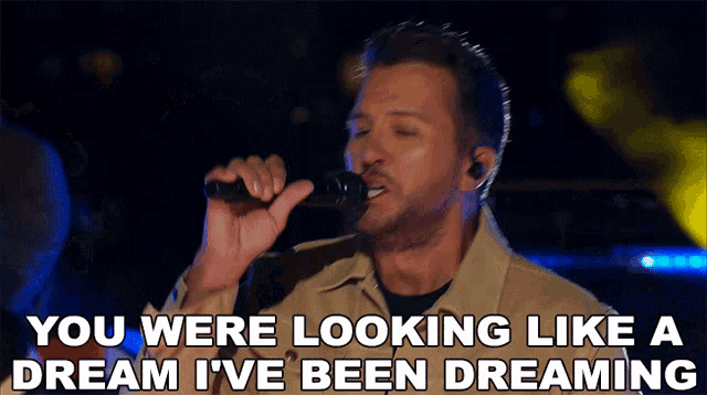 a man singing into a microphone with the words you were looking like a dream i 've been dreaming