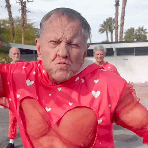 a man in a red shirt with hearts on it