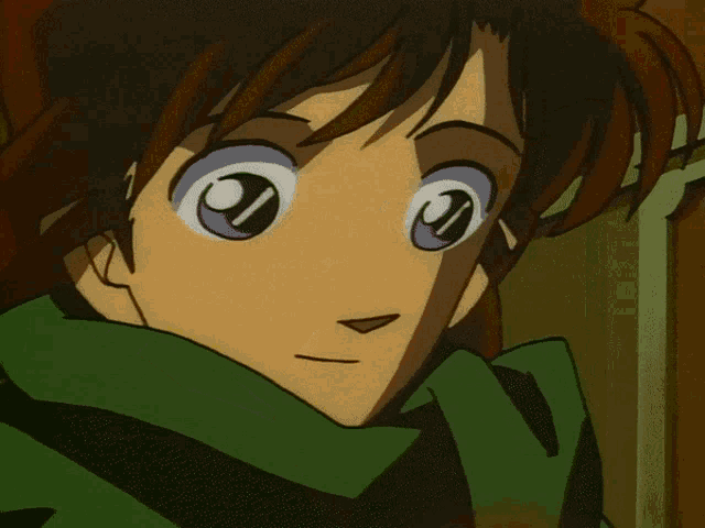 a close up of a cartoon character with a green scarf around his neck