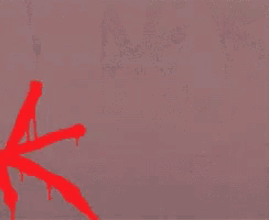 a girl in a green hoodie is holding a red star