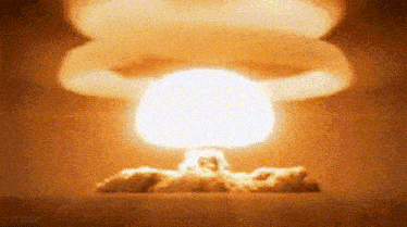 a nuclear explosion with a mushroom cloud rising from the ground