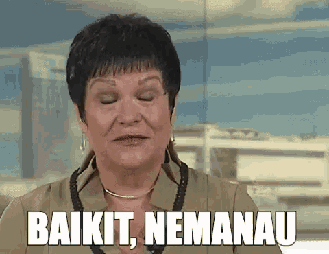a woman is making a funny face and the words baikit nemanau are above her