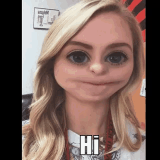 a woman with big eyes is making a funny face and says hi .