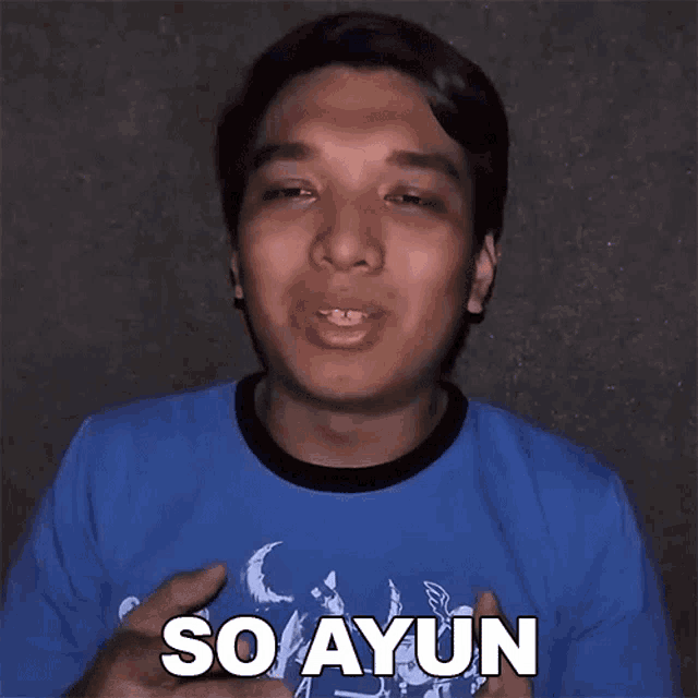 a man wearing a blue shirt with the word so ayun on it