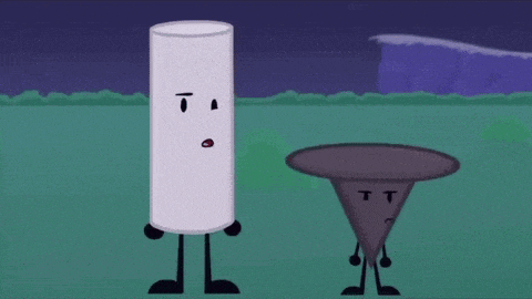 a white cylinder and a black cone are standing next to each other in a grassy field .