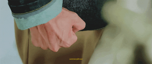 a close up of a person holding another person 's hand with a yellow watermark that says summerpleasure