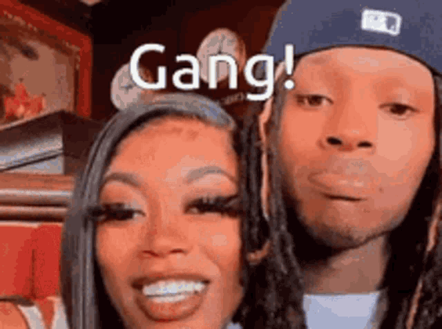 a man and a woman are posing for a picture together .