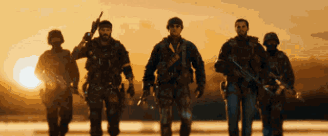 a group of soldiers walking in a line with the sun in the background