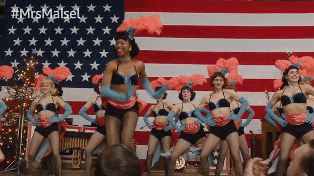 a group of women are dancing in front of an american flag with the hashtag #mrsmaisel