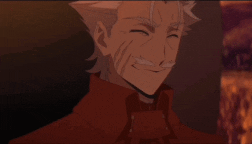 a man with gray hair and a red jacket is smiling