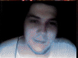 a pixelated image of a man 's face with red and blue dots on it