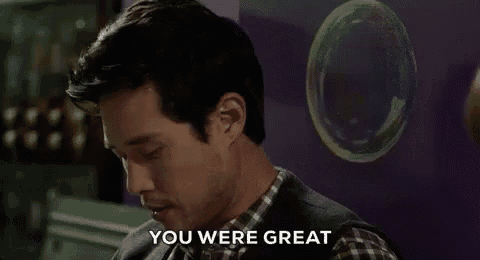 a man in a plaid shirt is saying `` you were great '' while looking at soap bubbles .