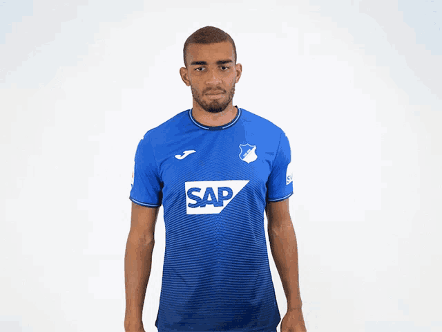 a man in a blue shirt that says sap on it