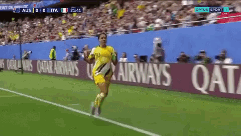 an advertisement for qatar airways is on the side of the field
