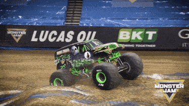 a monster jam truck is driving through the mud
