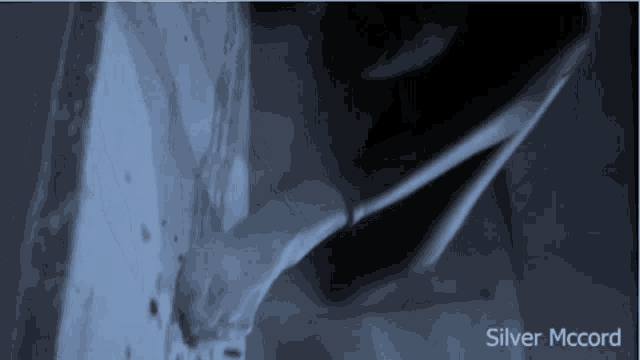 a person 's feet are shown in a dark room with the words silver mccord written below them