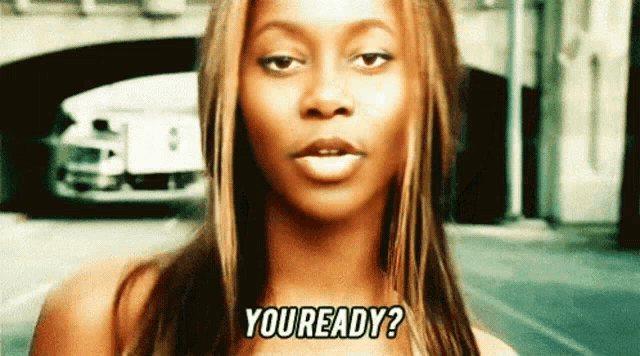 a woman says " you ready " in front of a bridge
