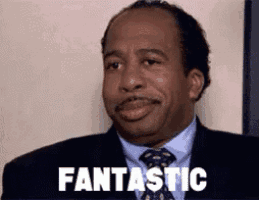 a man in a suit and tie is smiling and saying `` fantastic '' .