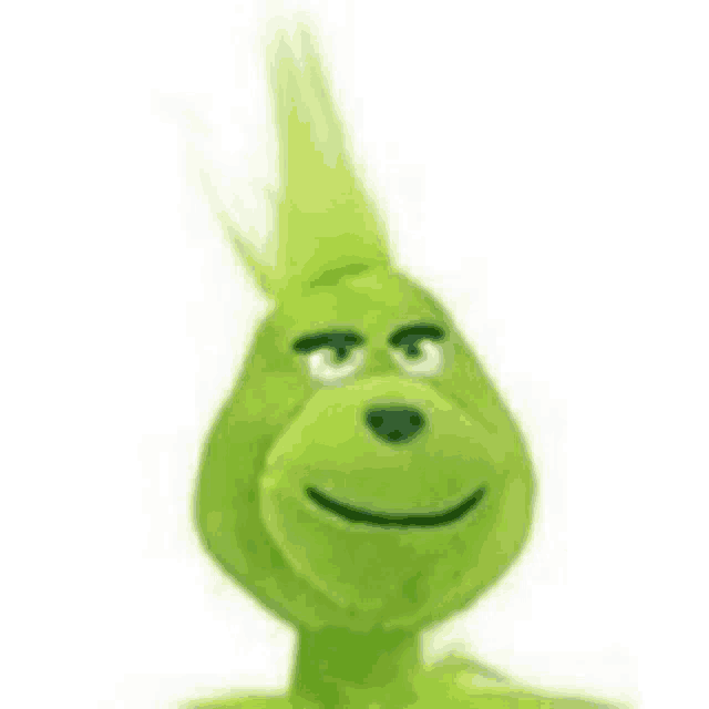 the grinch from the movie the grinch is a stuffed animal with a mohawk and white eyes .