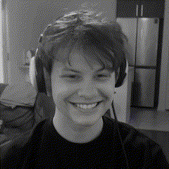 a black and white photo of a young man wearing headphones