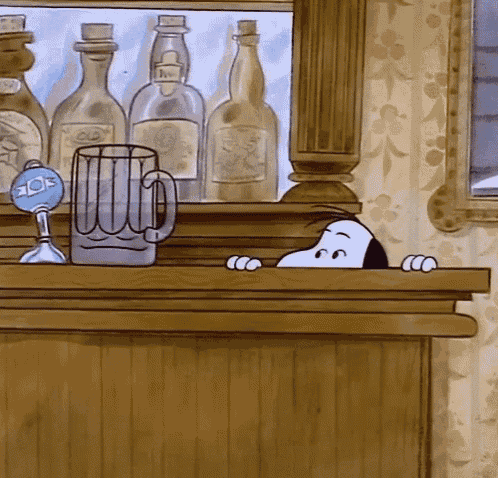 a cartoon of snoopy peeking over a bar with bottles and a beer mug