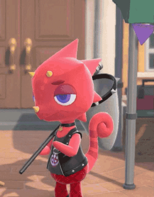 a red cartoon character is holding a stick and wearing a black jacket