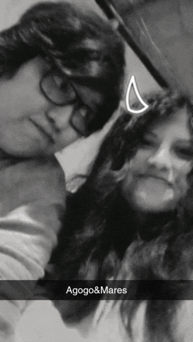 a black and white photo of a boy and a girl with the name agogo & mares on the bottom