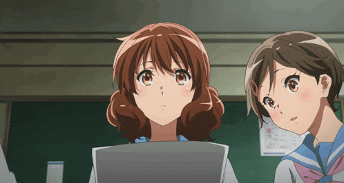 two anime girls are looking up at something in front of a chalkboard