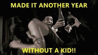 a man is taking a picture of a woman with a caption that says made it another year without a kid !